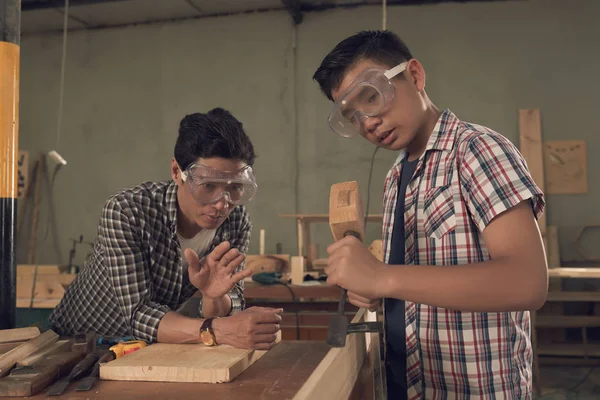 carpenters father and son in workshop