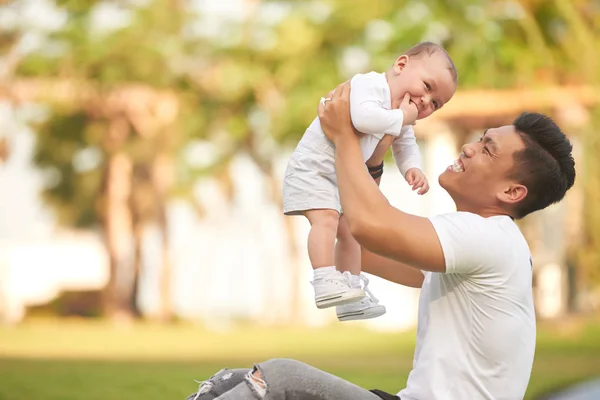 Asian Dad Cuddling Playing Adorable Baby Outdoors — Stock Photo, Image