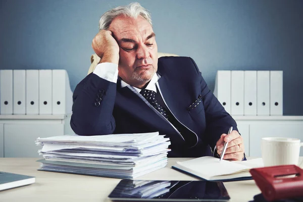 Bored Senior Man Sitting Office Table Pile Documents Papers — Stock Photo, Image