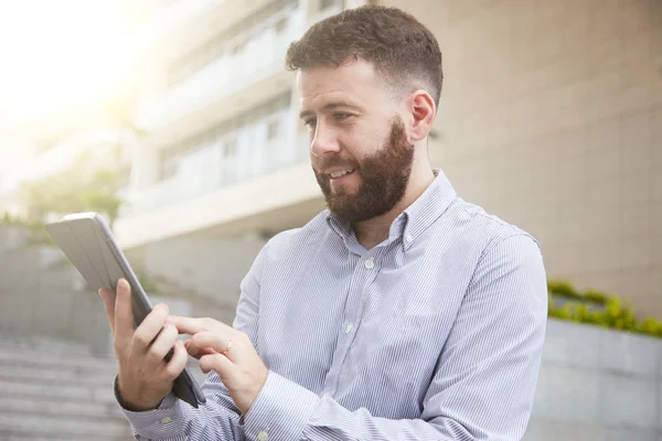 Smiling Young Entrepreneur Reading Article Tablet Computer — Stock Photo, Image