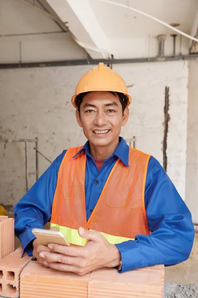 Happy Asian Construction Site Manager Texting Mobile Phone — Stock Photo, Image