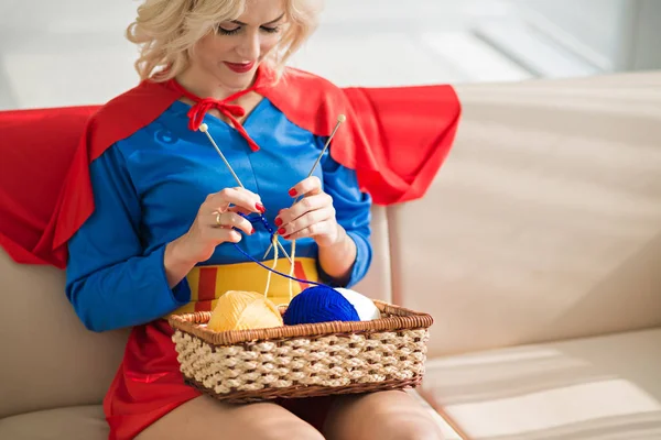 Young Beautiful Blond Caucasian Woman Wearing Superwoman Costume Knitting While — Stock Photo, Image