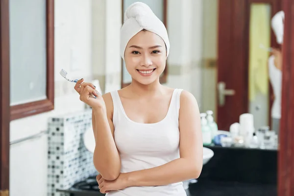 Young Cheerful Asian Woman Towel Head Holding Toothbrush Standing Bathroom — Stock Photo, Image