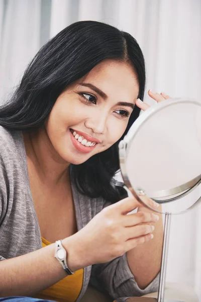 Attractive Filipino Female Charming Smile Looking Mirror Adjusting Makeup While — Zdjęcie stockowe