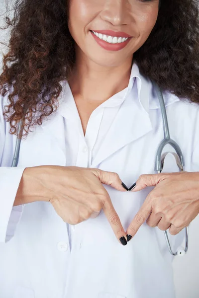 Portrait Smiling Woman Doctor Nurse Stethoscope Showing Heart Sign Isolated — Stockfoto
