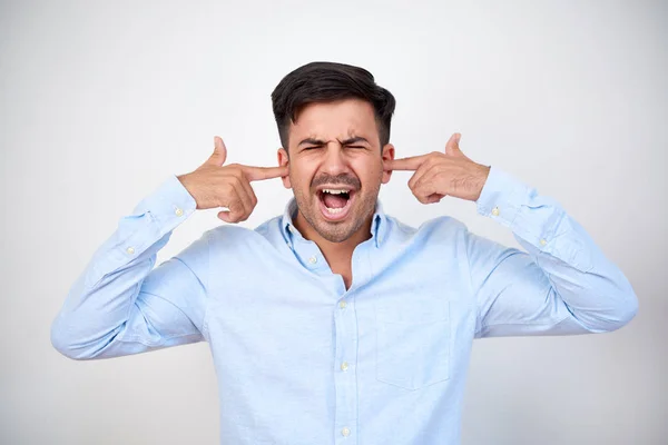 Image Screaming Young Man Standing Isolated White Wall Covering Ears — Stock Photo, Image