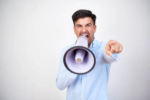 Portrait Young Dark Haired Man Announcing Megaphone Pointing Standing White — Stock Photo, Image