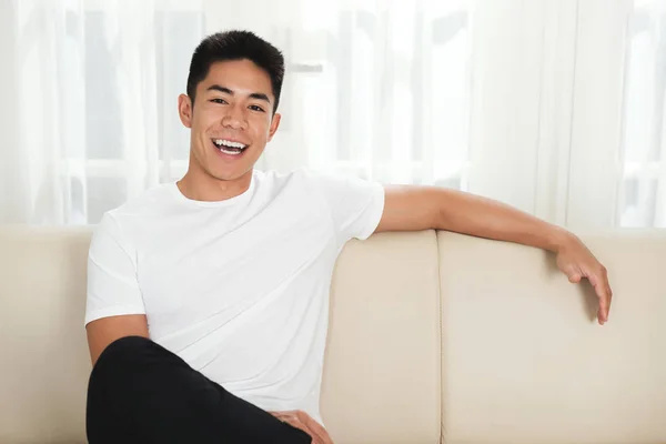 Cheerful Handsome Mixed Race Man Sitting Comfortable Sofa Home — Stock Photo, Image