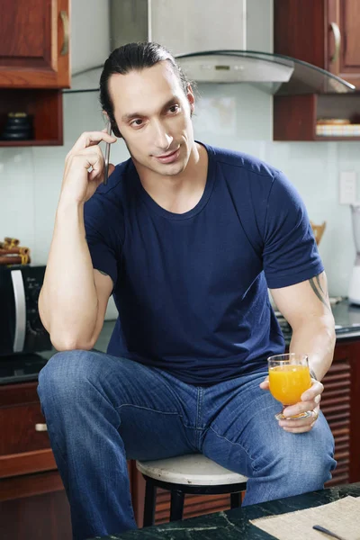 Young Man Drinking Glass Fresh Orange Juice Talking Phone — Stock Photo, Image