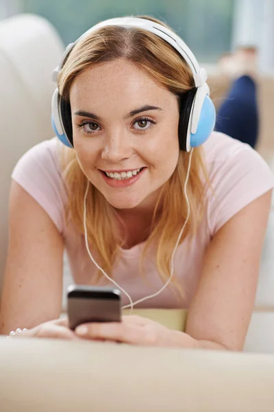 Pretty Smiling Young Woman Headphones Lying Bed Smartphone Hands — Stock Photo, Image