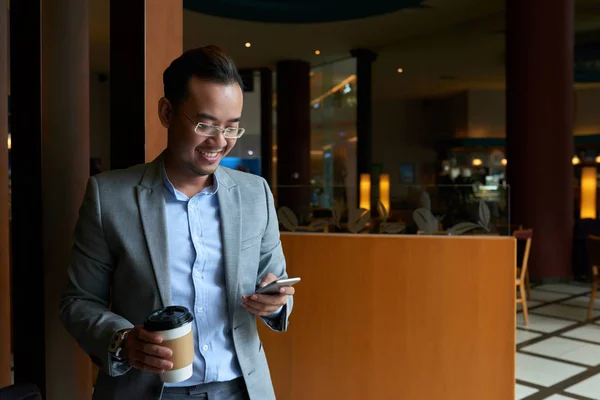 Smiling Handsome Businessman Drinking Coffee Scrolling Social Media — Stock Photo, Image