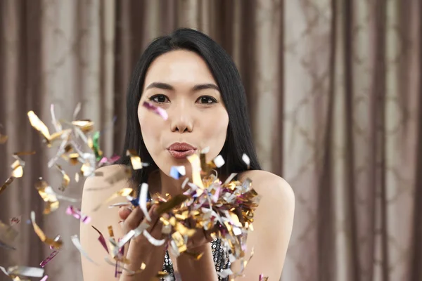Hermosa Joven Vietnamita Mujer Soplando Confeti Chispeante —  Fotos de Stock