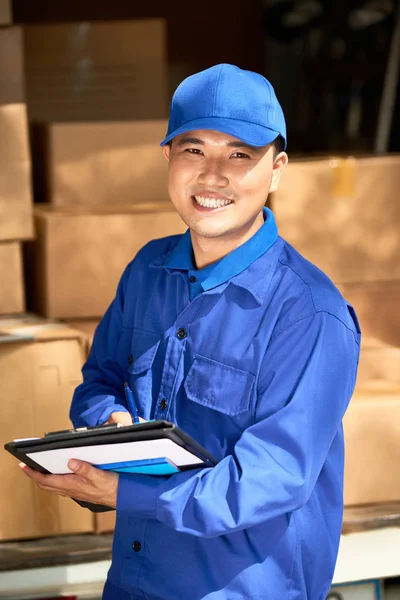 Smiling Handsome Asian Courier Signing Document Tablet Computer — Stock Photo, Image