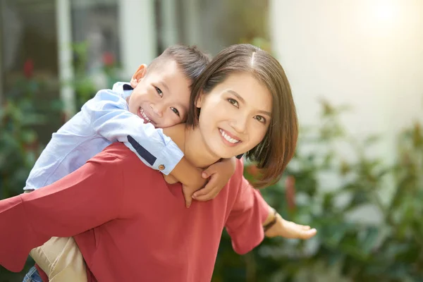 Young Asian Woman Giving Piggyback Ride Her Little Son — Stock Photo, Image