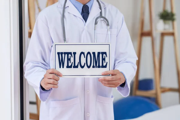 Clinic Owner Inviting Patients Welcome Signboard His Hands — Stock Photo, Image