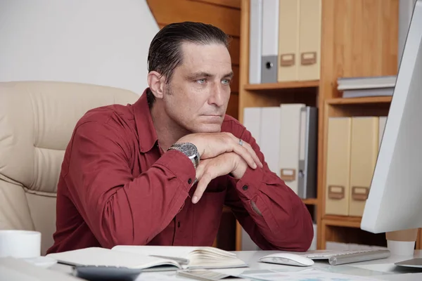 Handsome Pensive Middle Aged Businessman Red Shirt Using Computer While — Stock Photo, Image
