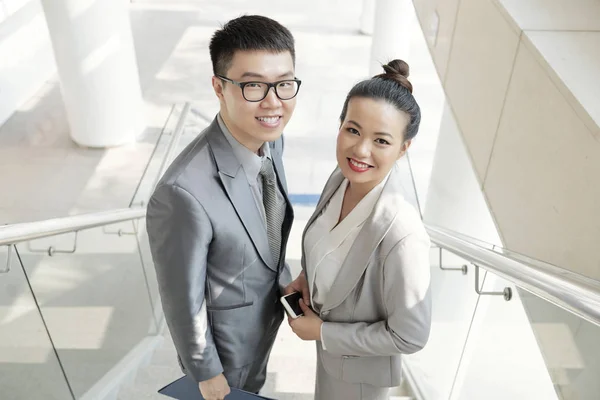 Positive Smiling Vietnamese Coworkers Standing Steps Looking Camera — Stock Photo, Image