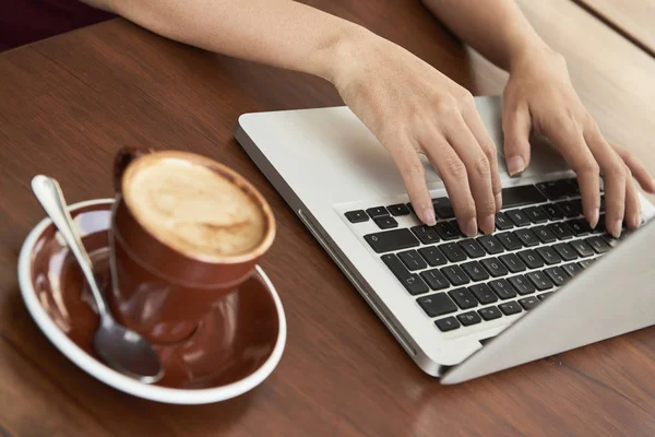 Close Female Hands Typing Keyboard Laptop Cup Coffee Wooden Table — Stock Photo, Image