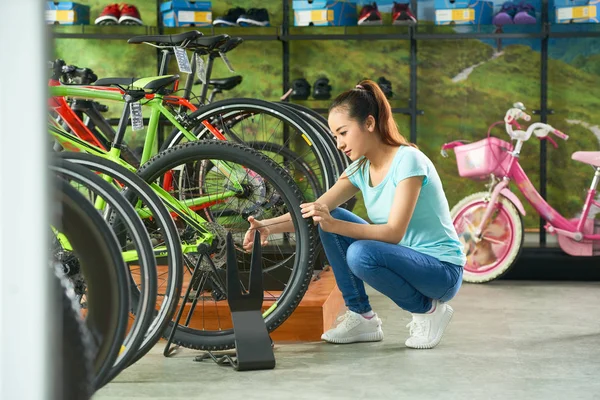Pretty Young Asian Woman Checking Wheels Tires Bicycle Store — Stock Photo, Image