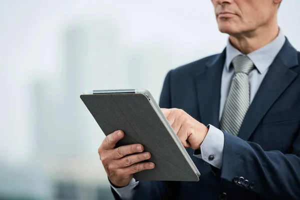 Cropped Image Middle Aged Businessman Reading Document Tablet Computer — Stock Photo, Image