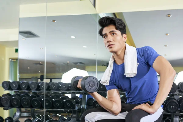 Young Asian Sportsman Sitting Holding Dumbbell His Hand Training His — Stock Photo, Image