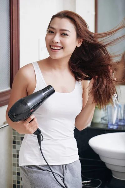 Joyful Young Woman Blowing Out Her Hair Bathroom — Stock Photo, Image
