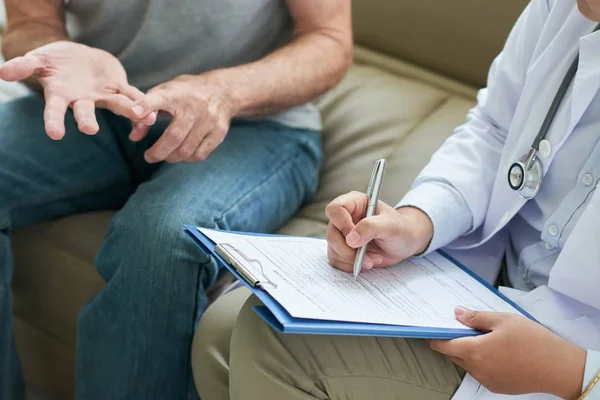 Crop Shot Doctor Home Visit Senior Man Listening Complaints Writing — Stock Photo, Image