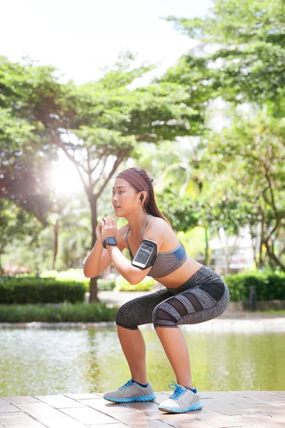 Young Fit Asian Woman Doing Squats Sunny Park — Stock Photo, Image