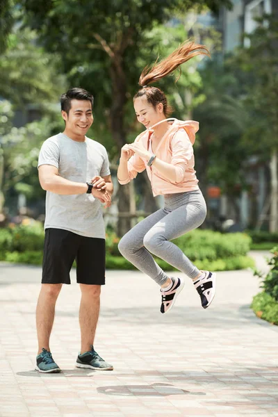 Athletic Sportive Asian Man Woman Jumping Park — Stock Photo, Image