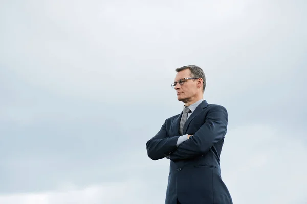 Caucasian Businessman Suit Grey Sky Arms Crossed — Stock Photo, Image