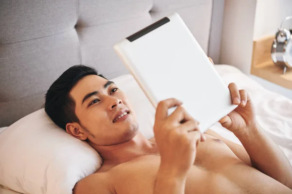 Smiling Young Asian Man Watching Video Tablet Computer — Stock Photo, Image