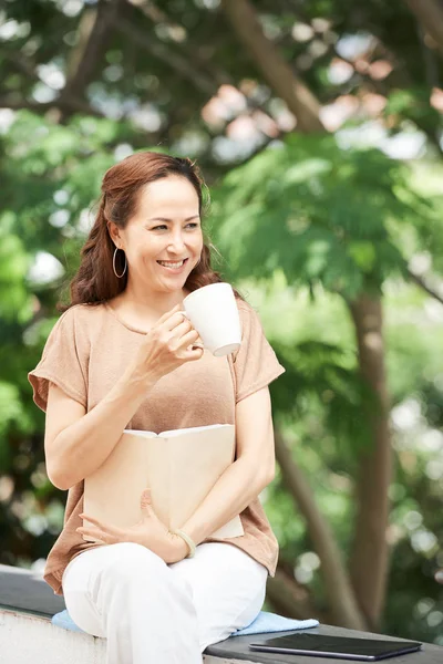 Middle Aged Asian Woman Enjoying Cup Coffee Good Book Outdoor — Stock Photo, Image