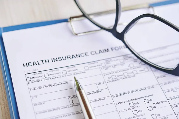 Health Insurance Claim Form Glasses Pen Stock Photo