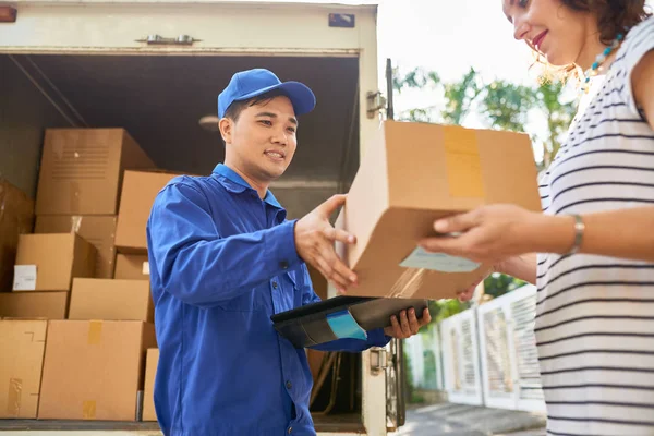 Smiling Asian Courier Delivering Parcel Young Woman — Stock Photo, Image