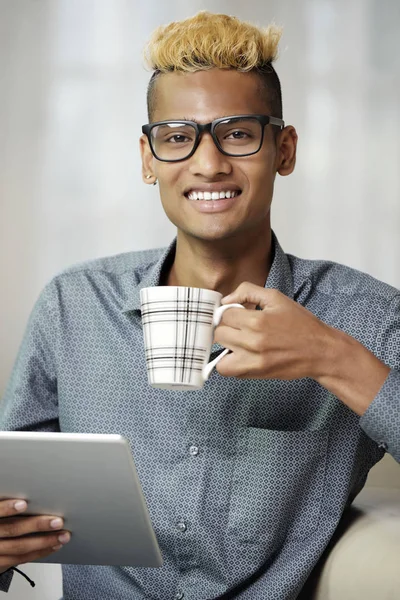 Portrait Handsome African Man Sitting Sofa Smiling Camera While Drinking — Stock Photo, Image