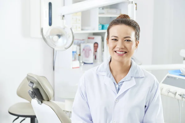 Portrait Asian Young Nurse White Coat Sitting Smiling Dental Clinic — Stock Photo, Image