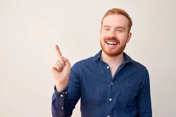 Portrait Red Haired Handsome Man Raising His Finger Pointing While — Stock Photo, Image