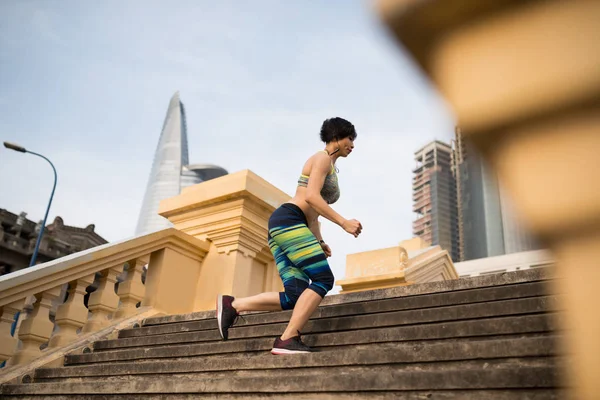 Sporty Young Vietnamese Woman Wearing Earphones Running Stairs City — Stock Photo, Image