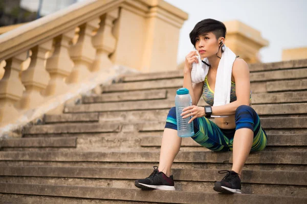 Pensive Young Female Jogger Drinking Fresh Water Running Outdoors — Stock Photo, Image