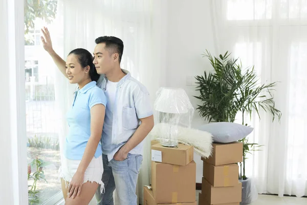 Young Vietnamese Couple Looking Window New Apartment — Stock Photo, Image