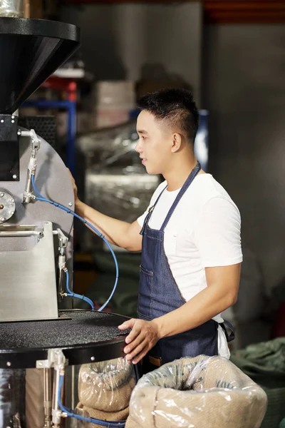 Young Male Factory Worker Apron Standing Machine Controlling Process Production — 스톡 사진