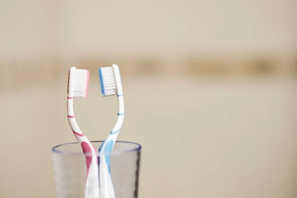 Family Set Two Toothbrushes Love Concept Transparent Glass Cup — Stock Photo, Image