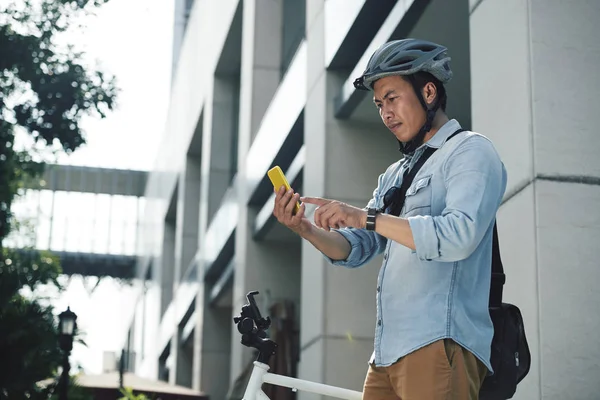 Mature Vietnamese Man Bicycle Helmet Setting Destination Coordinates — Stock Photo, Image