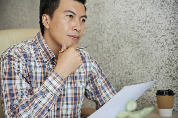 Mature Vietnamese Entrepreneur Double Thinking Signing Contract — Stock Photo, Image