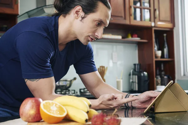 Young Man Communicating Somebody Online Using Tablet While Standing Kitchen — Stock Photo, Image