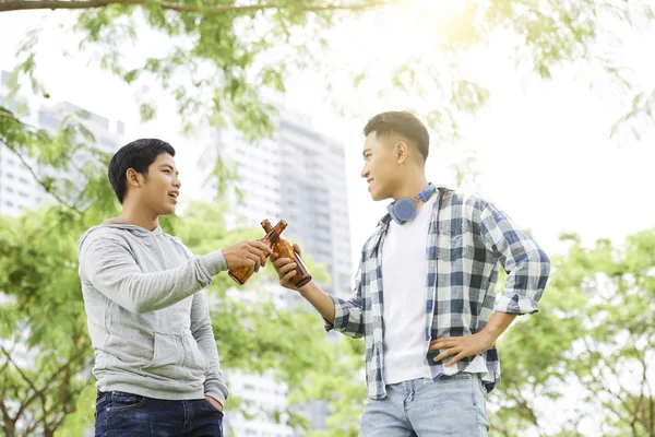 Two Young Asian Men Standing Toasting Bottles Beer Celebrating Meeting — Stock Photo, Image
