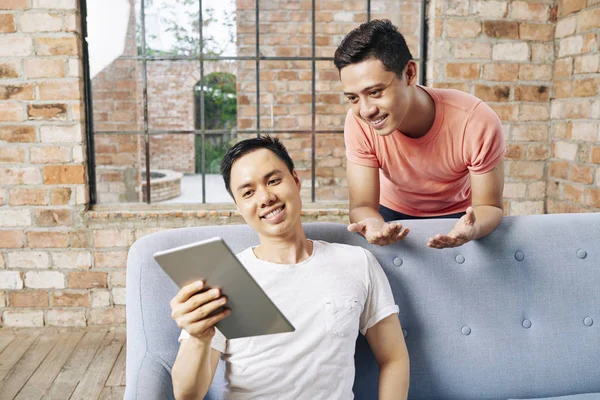 Smiling Young Asian Man Showing Coworker Interesting Business Idea Tablet — Stock Photo, Image