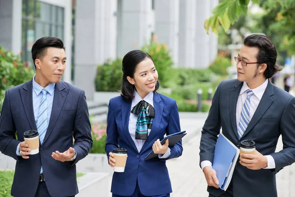 Young Business Colleagues Coffee Drinks Walking City Talking Each Other — 스톡 사진