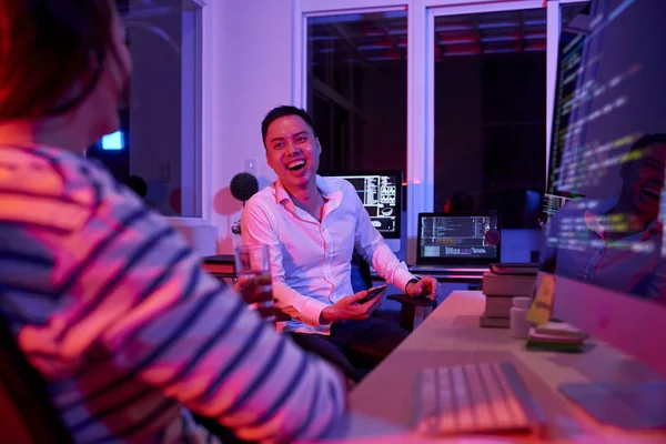 Young Office Worker Laughing His Conversation Colleague While Sitting Table — ストック写真