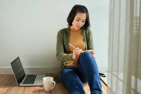 Asian Woman Sitting Floor Writing Diary Plan Laptop Tea Cup — Stock Photo, Image